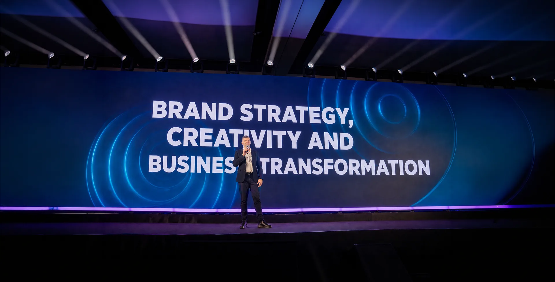 Avi Cicirean on stage — Brand Strategy, Creativity and Business Transformation